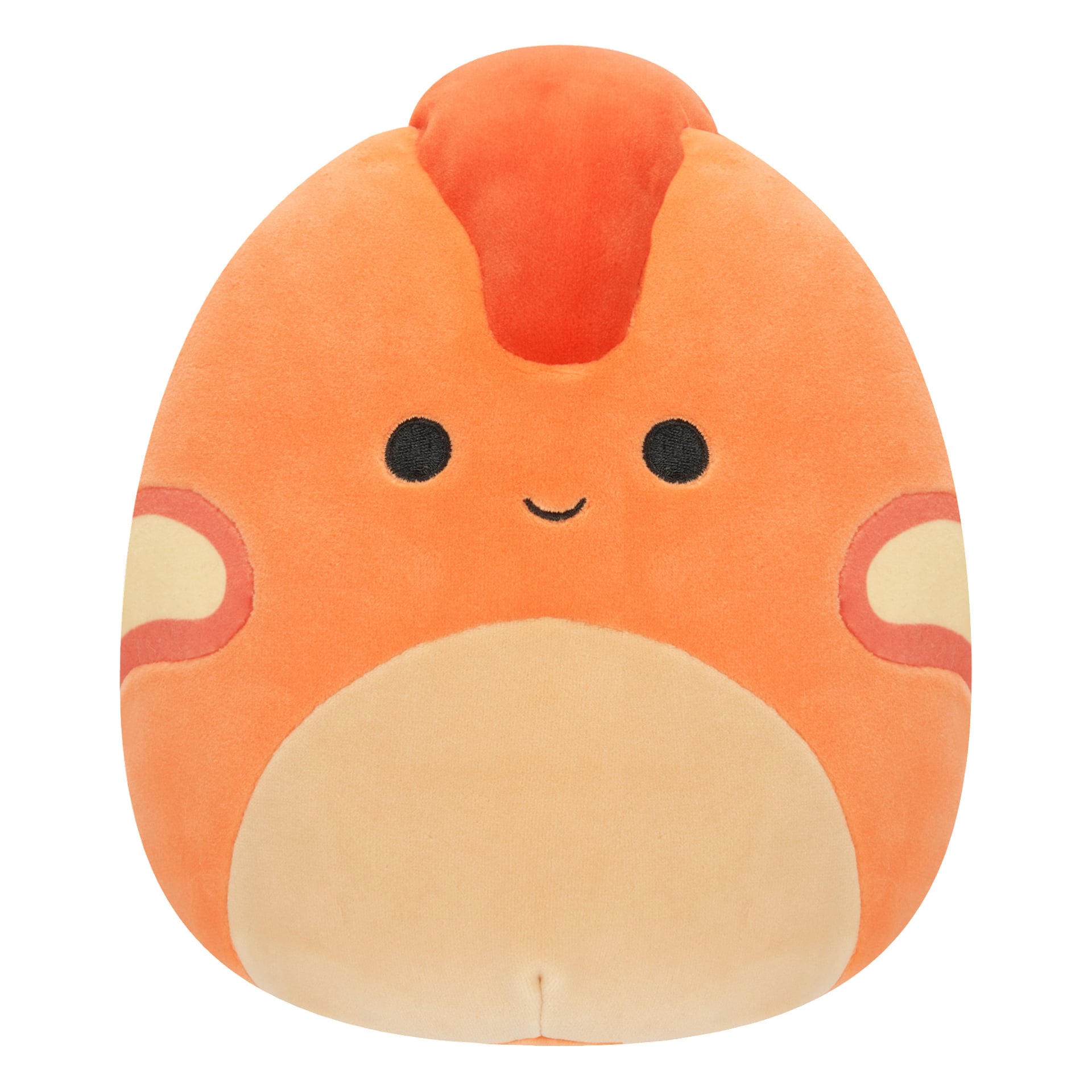 Pyöreä, oranssi Squishmallows-pehmolelu, jolla on kermanvärinen vatsa, pienet mustat silmät, iloinen hymy ja pieni punainen merkki otsassa, antaen sille suloisen sarjakuvamaisen ilmeen.
