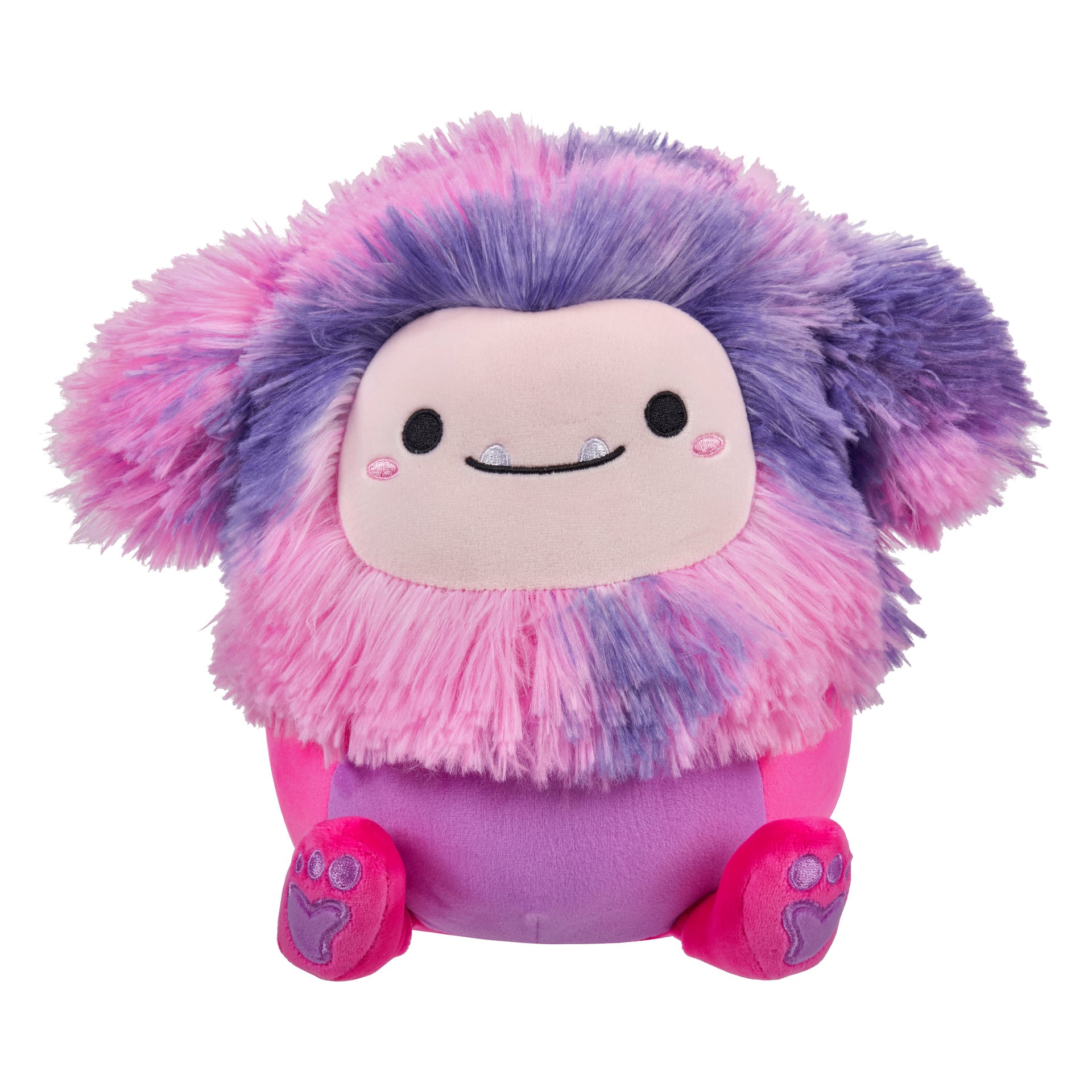 Superpehmeä Squishmallows-pehmolelu, jossa on pörröinen vaaleanpunainen ja violetti turkki, pyöreä kasvot, joissa näkyy kaksi silmää, lempeä hymy ja kaksi näkyvää hammasta, sekä vaaleanpunaiset tassunjäljet jaloissa. Sen pehmeä, pyöreä muoto on ihanteellinen halailuun.
