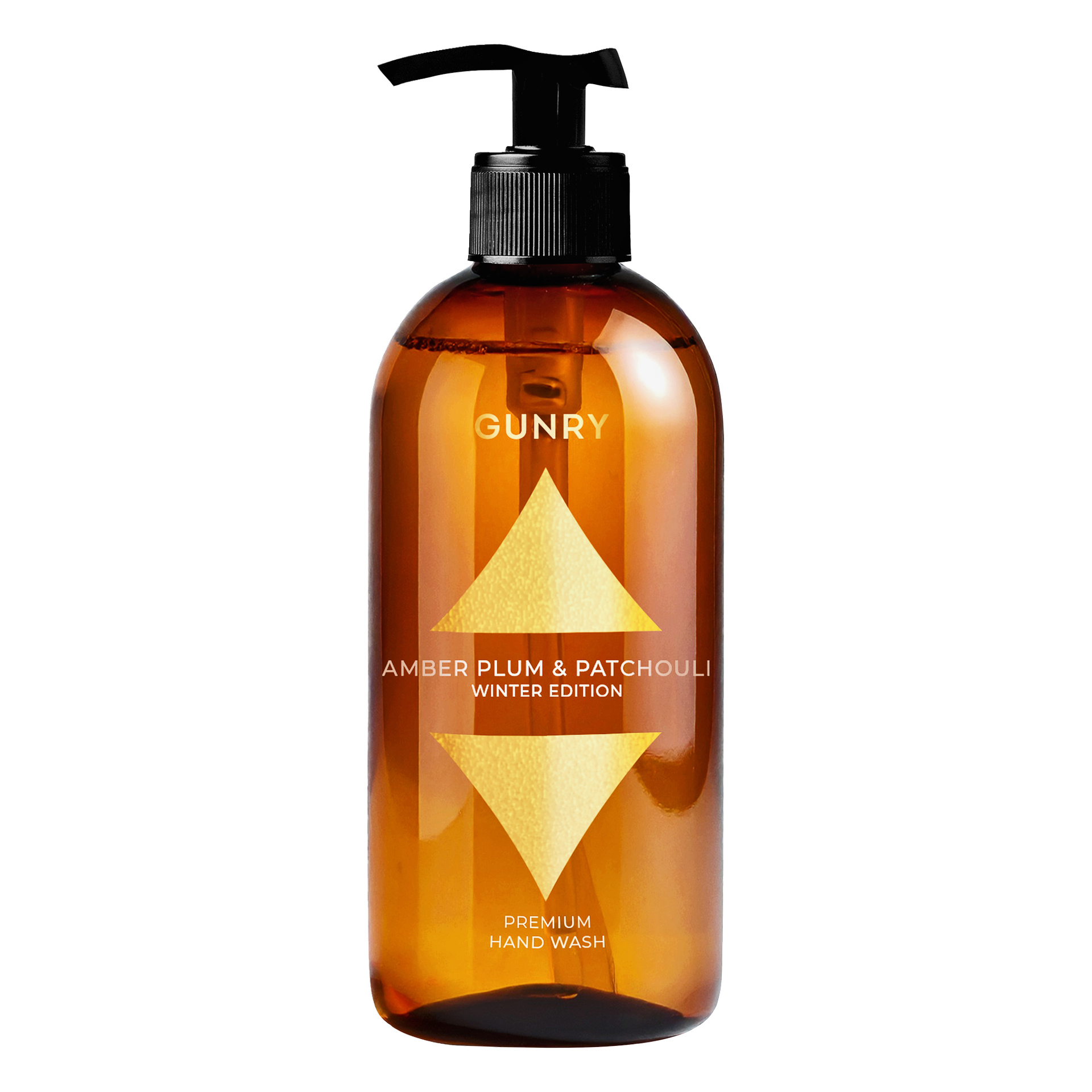 Meripihkanvärisessä muovipullossa, jossa on musta pumppu, on merkintä Gunry Hand Soap Winter Edition, ja se on koristeltu kultaisilla geometrisilla nuolilla, jotka osoittavat sekä ylös että alaspäin.