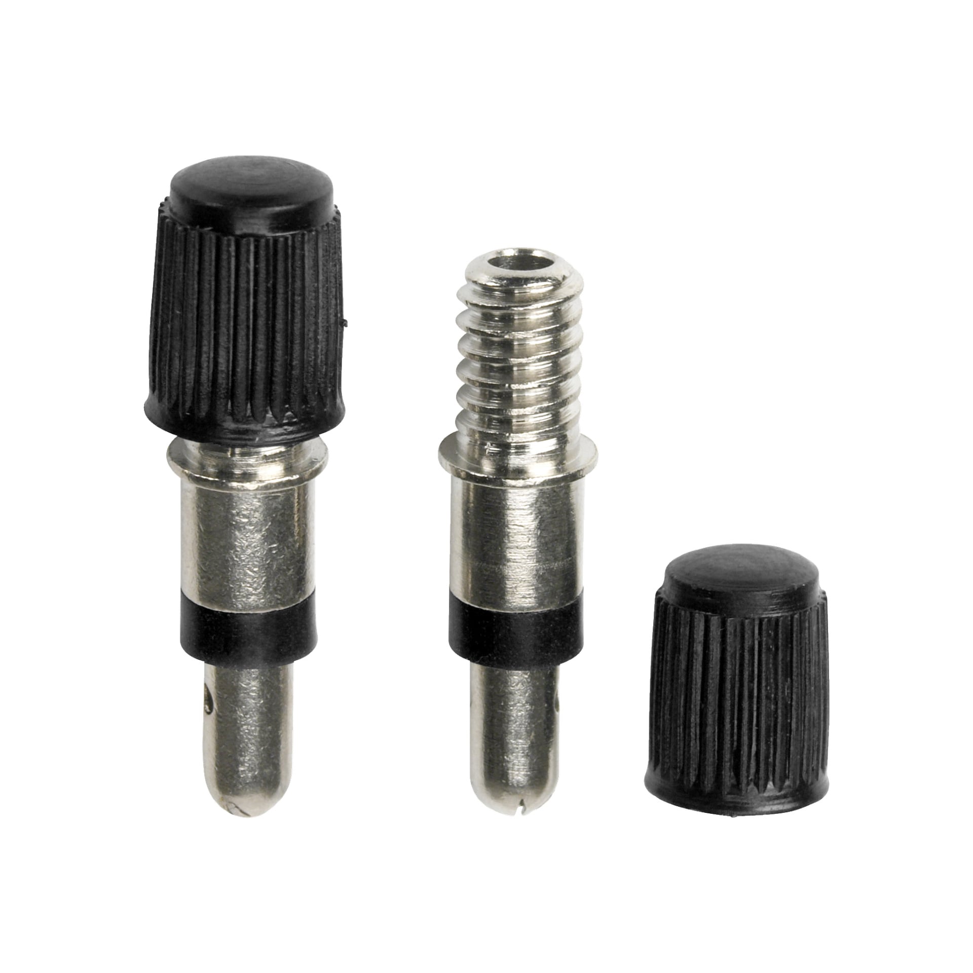 Dwa metalowe adaptery zaworów rowerowych Kayoba z czarnymi plastikowymi nasadkami z "Bike valve 2 pack" stoi pionowo. Jeden adapter jest złożony, a drugi odkręcany, aby pokazać gwintowany fragment. W pobliżu leży zapasowa plastikowa nakrowiec.
