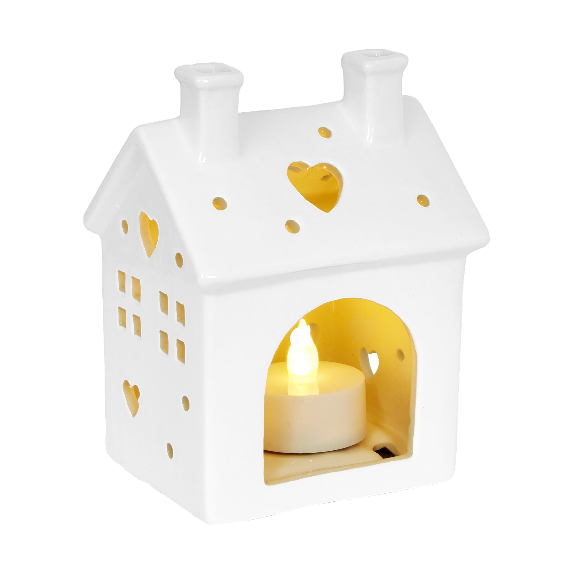 Menuett Lantern, biały ceramiczny dom ozdobiony wycięciami w kształcie serc, świeci ciepło przez lampkę wpadającą przez okna i otwory.