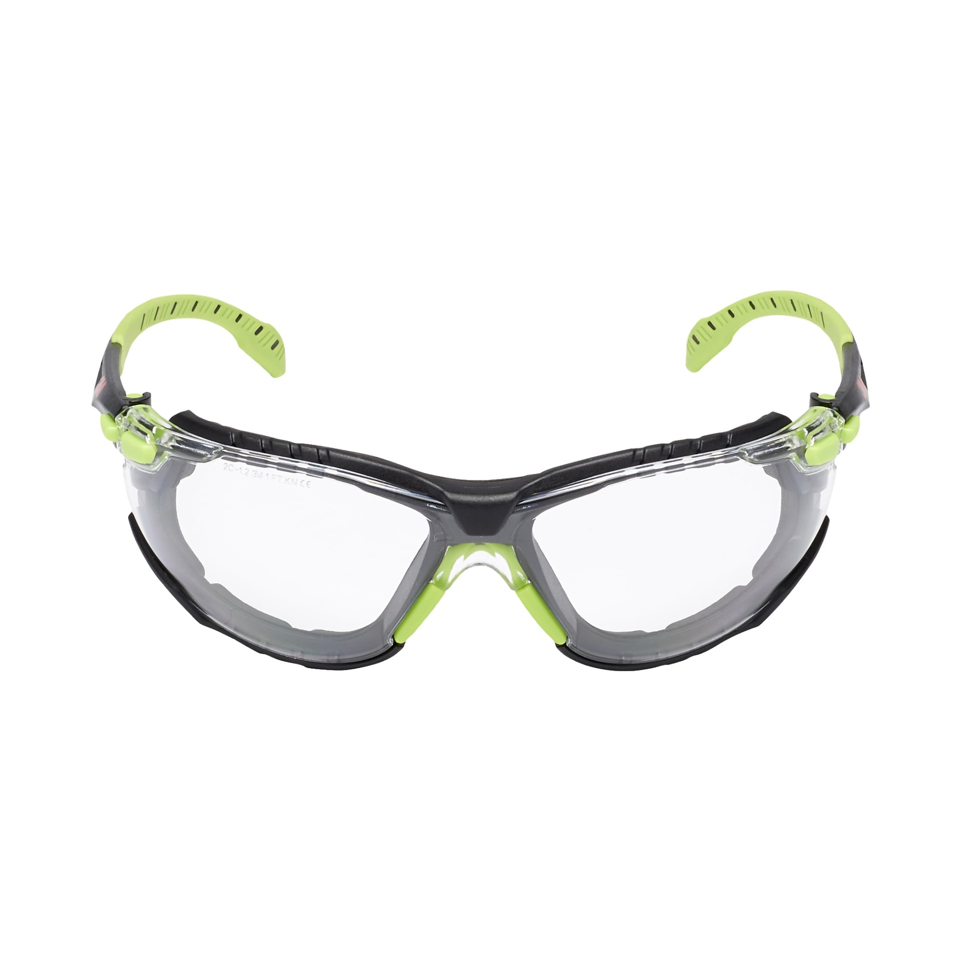 3M Safety Glasses Solus Soft 1000, visades framifrån med klara glas, gröna och svarta detaljer samt böjda justerbara armar. De stora omslagslinserna ger komplett ögonskydd.