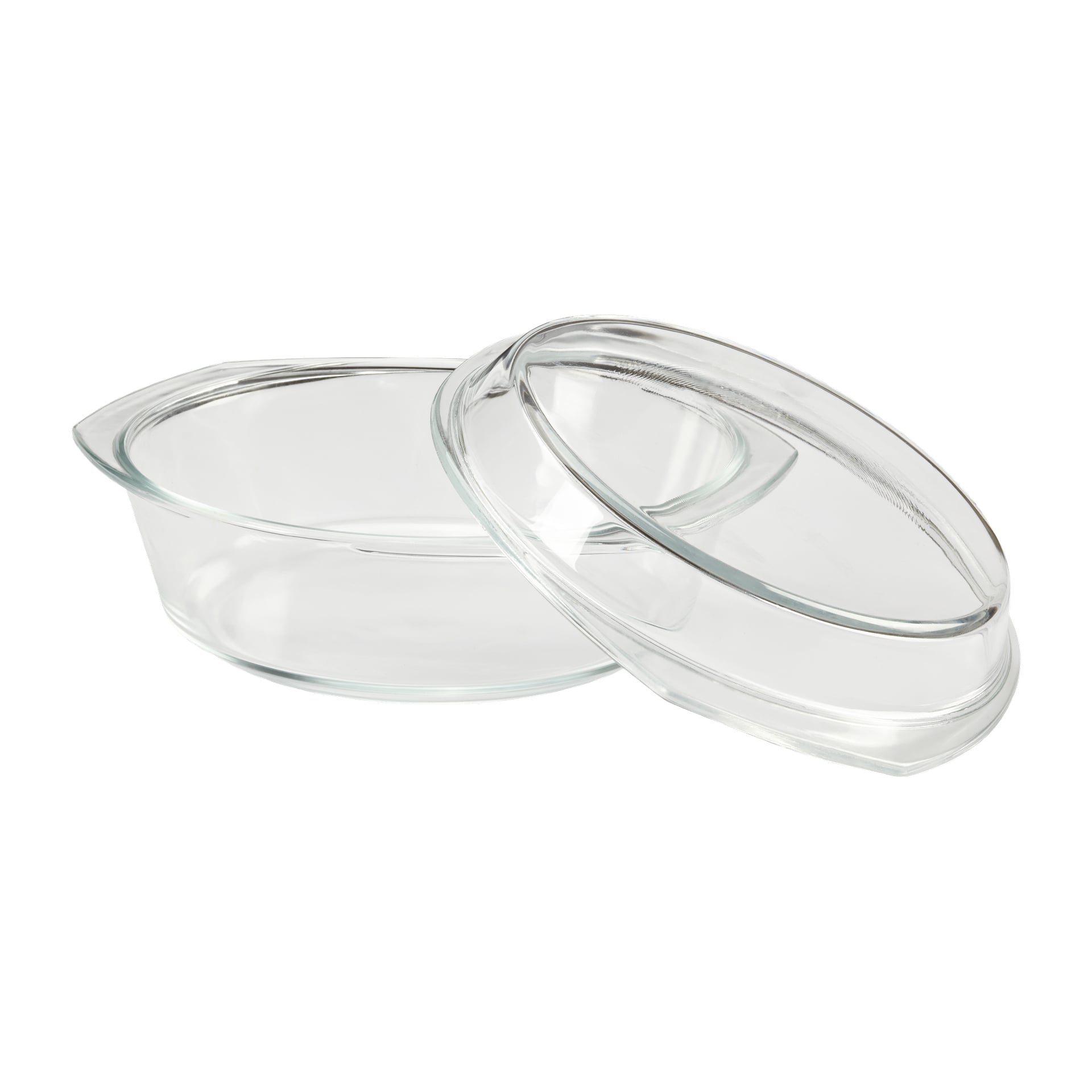 Menuett ugnsform är en oval klar glasform med matchande lock, locket placerat lite åt sidan för att visa det tomma insidan.
