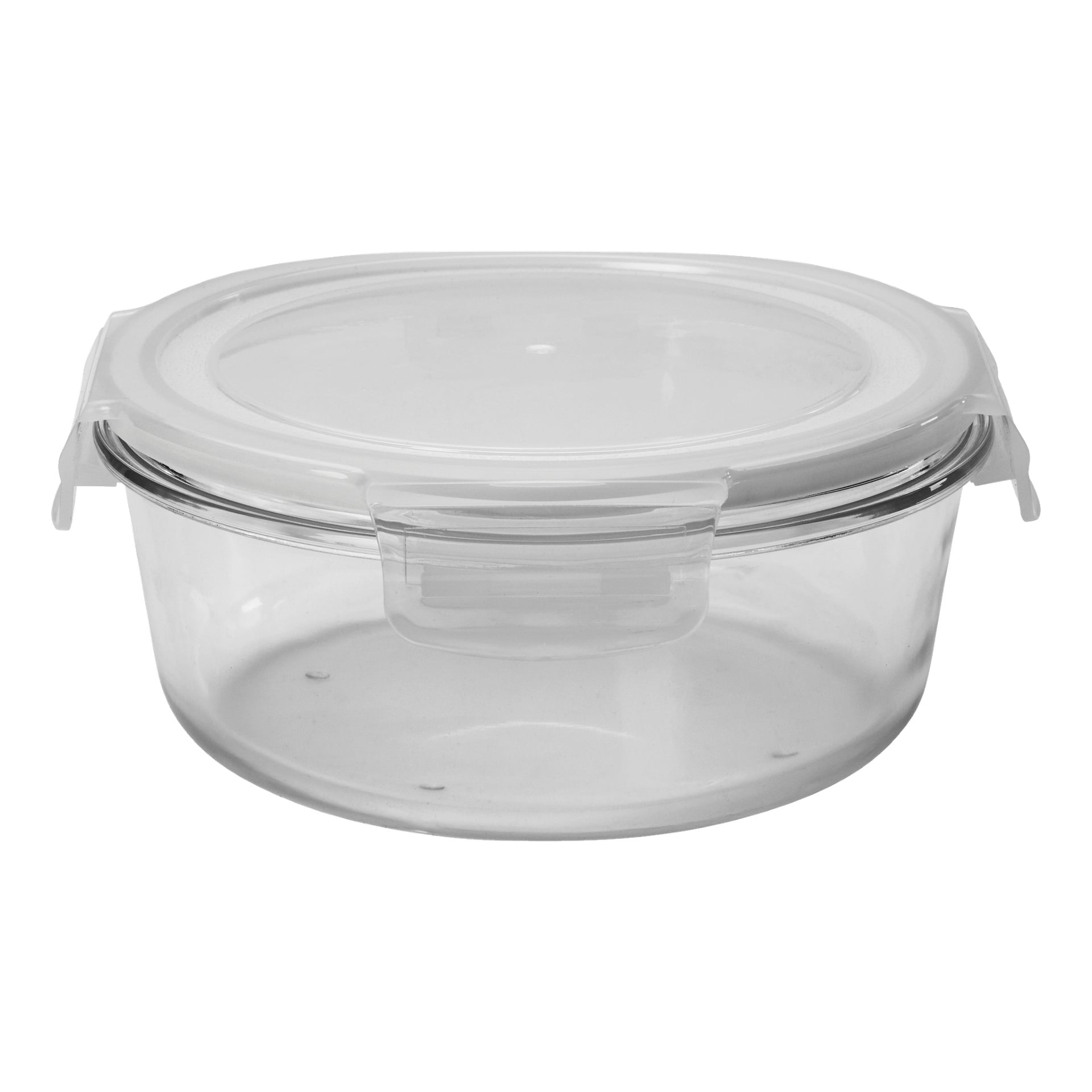 En Menuett Food-låda med en klar, rund glasbehållare, toppad av ett transparent plastlock och säkrad med ett lås framtill.