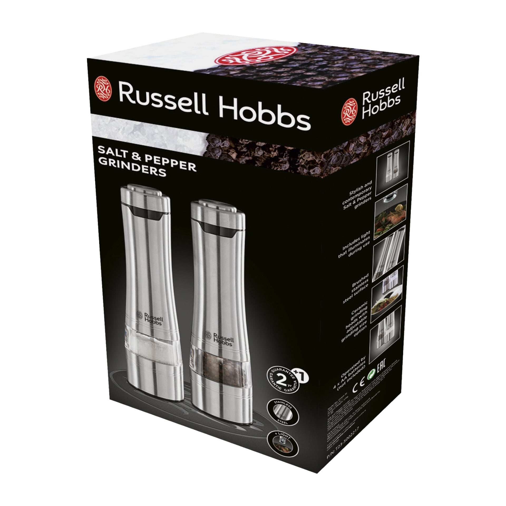 En svart låda med Russell Hobbs Electric Spice Mills 2 Pack visar två elektriska kvarnar i rostfritt stål placerade på en bricka, med produktbilder och funktioner markerade på förpackningen.