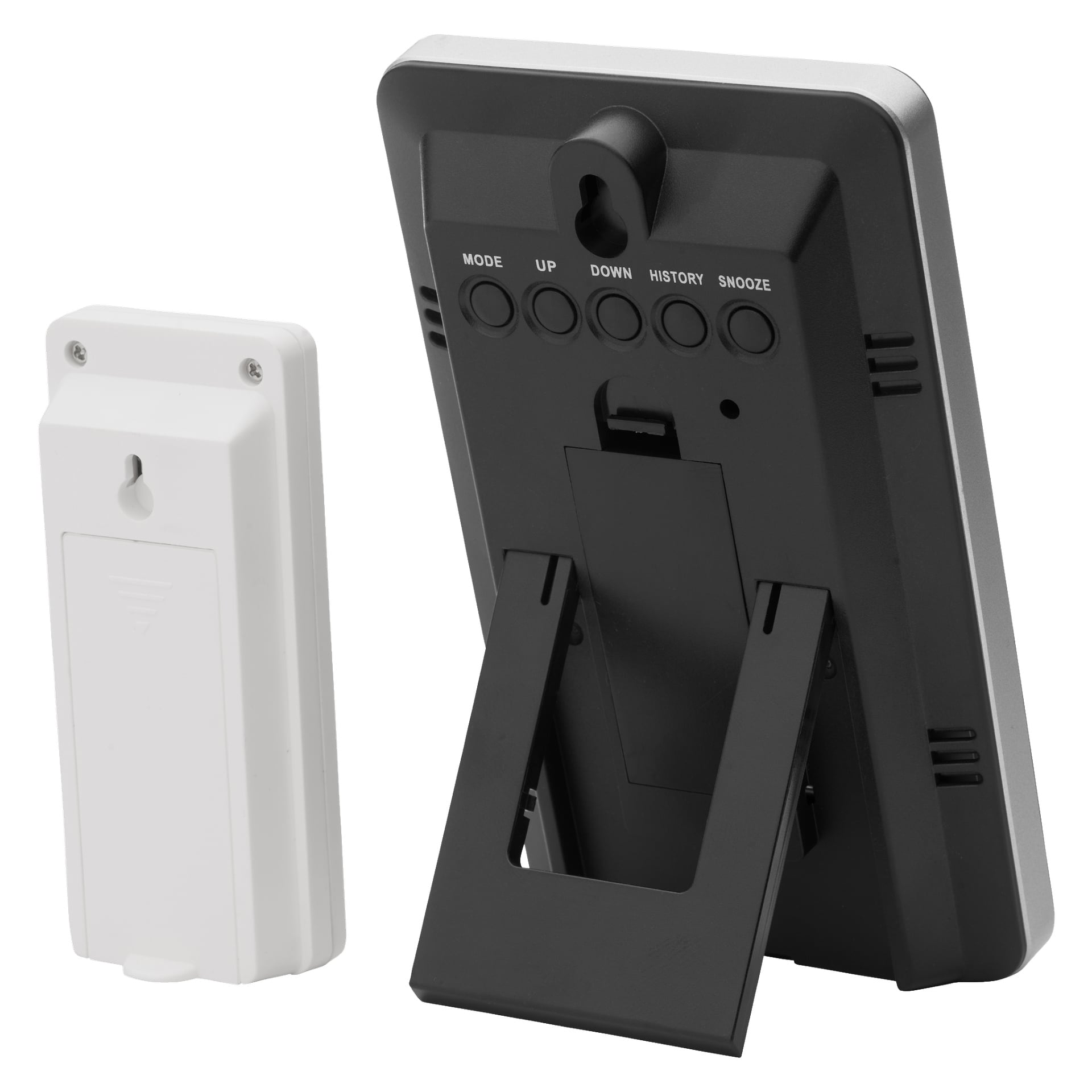 Marquant Wireless værstasjon, med et svart og sølvfarget design med utleggbart stativ og knapper bak, vises bakfra ved siden av sitt hvite rektangulære tilbehør.
