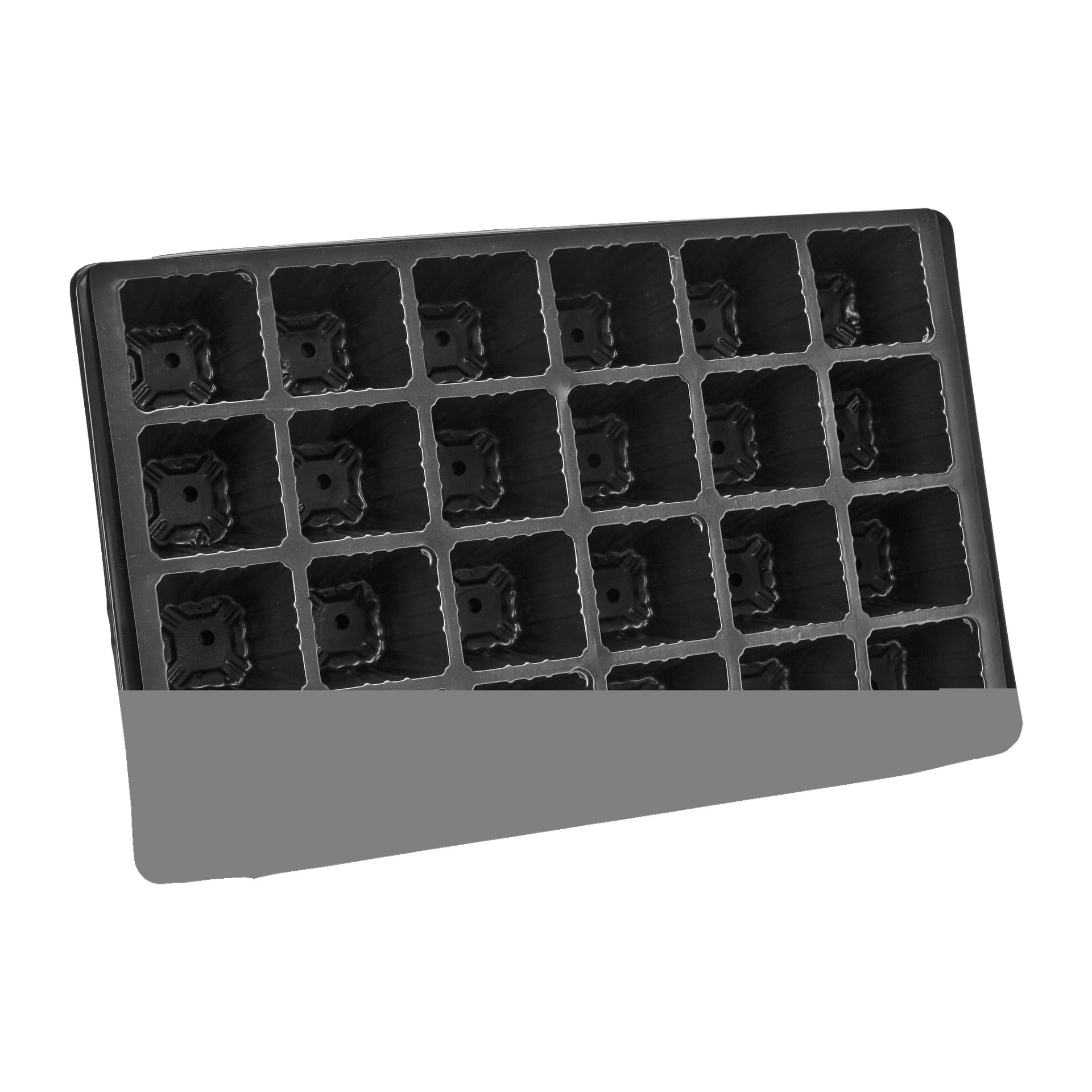 En Hard Head Seed-bricka gjord av plast med flera fyrkantiga fack är lutad något, med den nedre delen delvis dold av ett grått block.