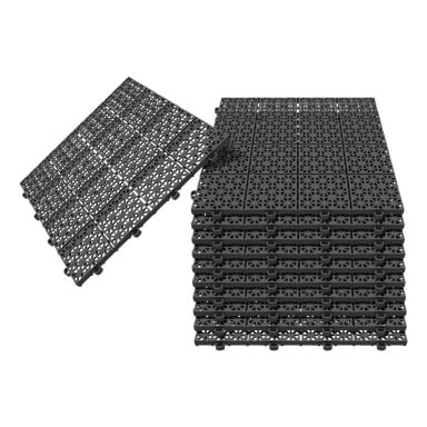 Esillä on 11-pakkaus Hard Head Floor -laattoja, jotka koostuvat toisiinsa lukittuvista mustista muovilaatoista, joissa on geometrinen leikkaus. Yksi laatta seisoo pystyasennossa näyttäen alapuolen ja liitintapit, mikä osoittaa, miten modulaarinen järjestelmä yhdistyy.