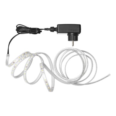 En spiralad Anslut LED-remsa vilar i ett transparent hölje, ansluten till en svart strömadapter och kabel, med många små LED-lampor längs dess längd.