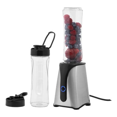 Ruostumattomasta teräksestä valmistettu Bright Blender on esillä yhdessä läpinäkyvän pullon kanssa, joka on täynnä mansikoita ja mustikoita, tyhjä pullo ja kaksi mustaa kantta.