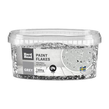 En klar plastboks merket Paint flakes fra Hard Head, grå, 500g, for innendørs bruk. Emballasjen viser flakutseendet og et svensk flagg med Made in Sweden.