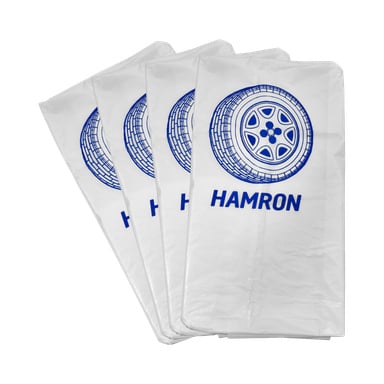 En 4-pakning med hvite plastdekkposer, hver med en blå grafikk av et dekk og teksten HAMRON.