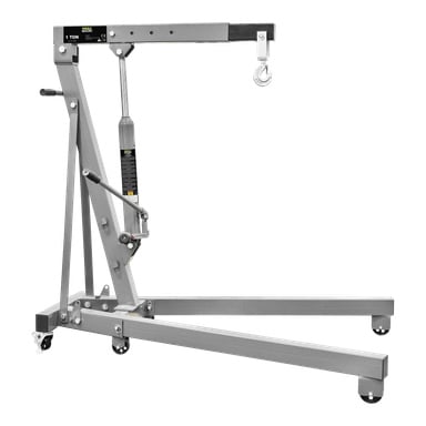 En stålkran från Meec Tools Workshop med grå metallyta, utrustad med en hydraulisk domkraft, hjulhjul för enkel rörelse och en krok vid spetsen av dess horisontella arm. Byggd för att hantera laster upp till ett ton.
