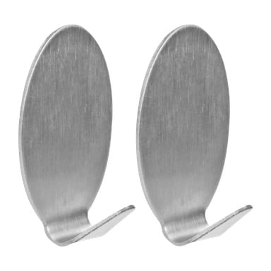 Et par Hard Head metalllimkroker på veggen vises i deres topakningssett. Hver krok har en oval bakplate med børstet metallfinish og en forsiktig buet krok som strekker seg fra bunnen for å henge opp gjenstander.