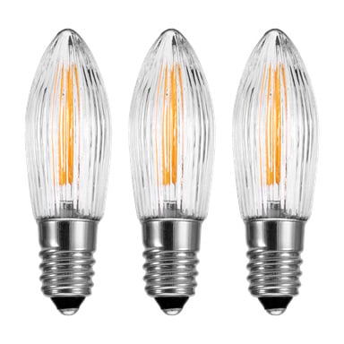 Tre EKVIP reservlampor för Advent candlestick LED (3-pack) med klart, räfflat glas, silverskruvsocklar och synliga orange filament är uppradade vertikalt.