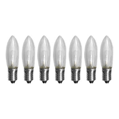 Sju klara, ljusformade EKVIP reservlampor för en Advent-ljusstake (LED, 7-pack) med metallskruvar är uppradade i en horisontell rad.