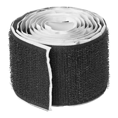 En närbild på en Hard Head Velcro-remsrulle med lim, delvis utrullad för att visa den texturerade hook-and-loop-ytan.