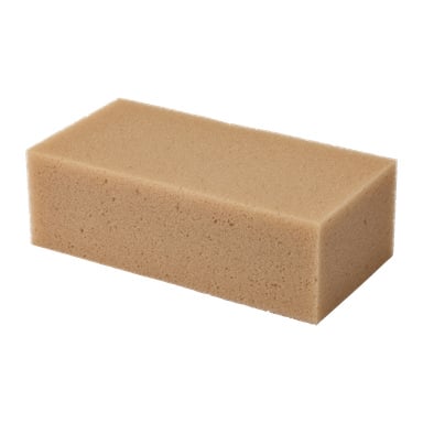 En beige, rektangulär svamp med porös textur visas. Etiketten lyder Hamron-svampen.