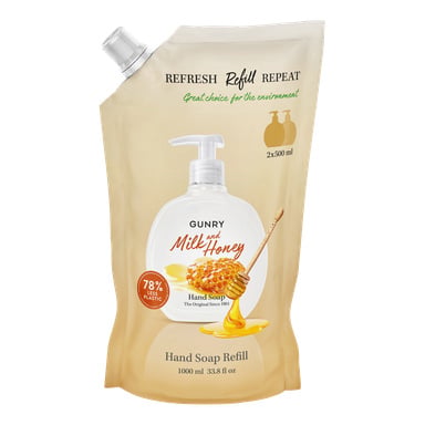En 1000 ml påfyllningspåse med Gunry Handtvål i Milk & Honey-varianten, visad med bilder på en tvålautomat, honungskaka och honungsdoppare. Förpackningen betonar 78 % minskad plastanvändning och visar dess miljövänliga egenskaper.