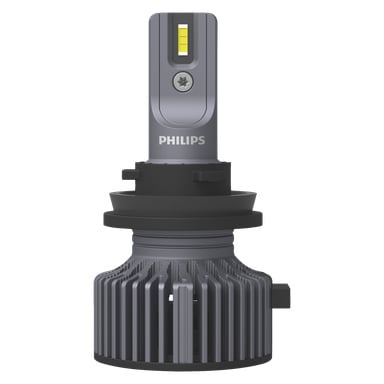 Die Philips LED Ultinon Pro3022 Scheinwerferlampe hat einen rechteckigen grauen Sockel, freiliegende gelbe LED-Chips, einen runden schwarzen Kühlkörper mit Finnen unten und zeigt das PHILIPS-Logo vorne.