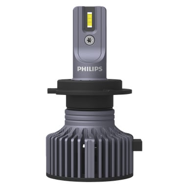 En detaljerad närbild av Philips Cars LED-strålkastarlampa Ultinon Pro3022 framhäver dess grå metallkaross, exponerade gula LED-chip och den räfflade kylflänsen vid basen som är designad för kylning.