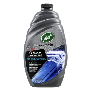 En grå plastflaska med Turtle Wax HS Ceramic Wash & Wax bilschampo med blå och vit etikett, som visar uttrycken omedelbar torkning, glans och skydd för bilar.