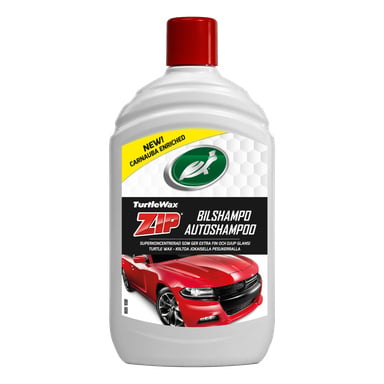 En vit Turtle Wax Zip bilschampoflaska med röd kork. Etiketten visar en röd sportbil och text som markerar "Carnauba Enriched."