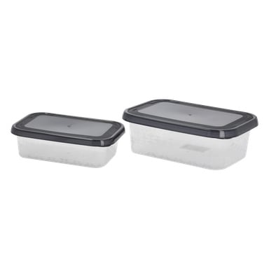 Ett par genomskinliga plastbehållare från Menuett Lunchbox med svarta lock står bredvid varandra. Den vänstra behållaren är mindre, medan den högra är större. Båda har ett svagt rutnät längs sidorna.