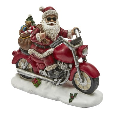 EKVIP:s "Tomten på motorcykel" visar en tomtefigur med solglasögon som kör en röd motorcykel, bärande på en säck med presenter och en nallebjörn sticker ut. Figuren står på en snötäckt bas bredvid två små inslagna presenter.
