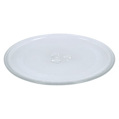 En rund, klar glas-mikrovågsplatta med tre små vattendroppar synliga på ytan.