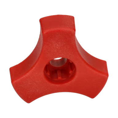 Ett rött plastgrepp med tre stift och ett centralt hål.