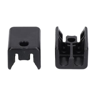 Et par svarte plastklips fra Wire Mount Lawn Mower, den ene vist ovenfra som fremhever et sentralt hull, den andre nedenfra med spor.