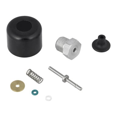 Avtryckarsetet inkluderar svart lock, metallbult, gummipackning, metallfjäder, stång och flera små brickor.