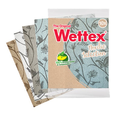 En 10-pakning med Wettex Dishcloths Nordic Selection, med blå, brune, hvite og grå bladmønstre på svampklutene. Emballasjen sier «The Original Wettex», «10x», og understreker deres 100 % biologisk nedbrytbare og komposterbare egenskaper.