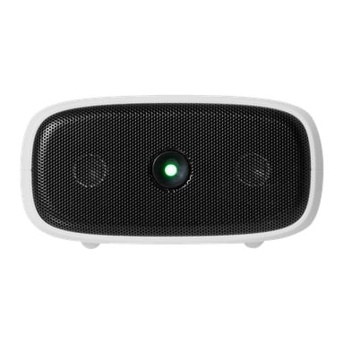 Nærbilde av Kvitt Mouse Repellent, en svart enhet med hvit kant, med grønt midtlys og frontgitter i netting.