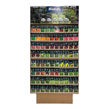 Ett displayställ med prydligt organiserade Weibulls fröpåsar för morötter, paprika, sallad och gurkor i märkta rader.