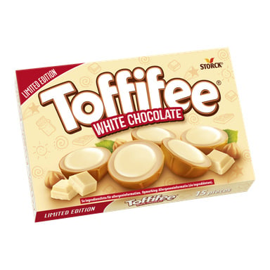 Toffifee White Chocolate Limited Edition-lådan visar varumärkeslogotypen och godis med vita toppar, hasselnötter och bitar av vit choklad.