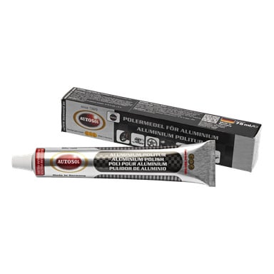 Ett rör Autosol Aluminium Polish står framför dess svarta låda. Tuben är märkt "Aluminium polish Aluminium Polish" och rymmer 75 ml. Lådan har en röd cirkellogotyp och frasen "Made in Germany."