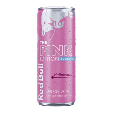 En hög rosa burk Red Bull Pink Edition Sugarfree med silver- och vit text, vattendroppar och "Hallonsmak" för hallonsmak.