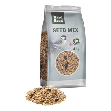 En 1 kg Hard Head Seed Mix-påse för vilda fåglar har en fågel och frön på förpackningen, med blandade frön staplade framför.