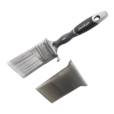 En pensel med svart og grått håndtak merket Jordan+ og 50 mm, plassert ved siden av det gjennomsiktige plastbeskyttelsesdekselet.