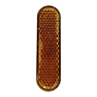 Närbild på en oval, texturerad bärnstensfärgad sidoreflektor för en elscooter, designad för att förbättra sikt och säkerhet.