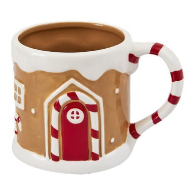 Keramikmugg som liknar ett pepparkakshus med röd dörr, vita fönster, handtag med polkagrisrandig polkagris och beige inredning.