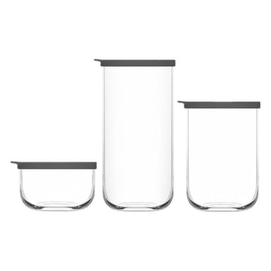 Tre genomskinliga glasburkar från "Storage Jars 3 pieces"-setet från No brand står uppradade sida vid sida, var och en med ett platt, mörkgrått lock och olika i höjd.