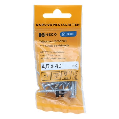 Ett 15-pack Heco sänkta träskruvar, storlekarna 4,5 x 40 mm, designade för inomhusbruk. Den orange etiketten visar produktdetaljer och säkerhetsikoner, medan den transparenta förpackningen avslöjar skruvarna inuti.