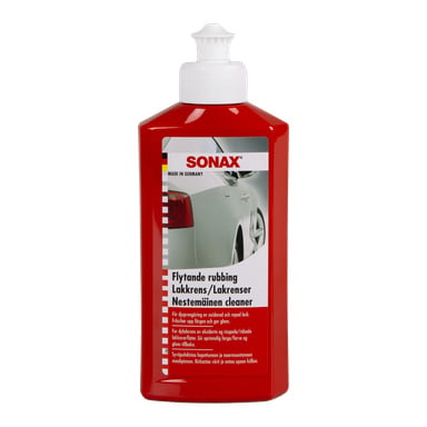 Punainen Sonax Rubbing -pullo auton maaliin, jossa on valkoinen korkki, etulappu, jossa on erilaisia tekstejä, sekä kuva hopeisesta autosta.