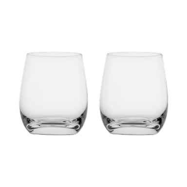 To klare, tomme, stilkeløse drikkeglass fra Menuett står side om side. Hvert glass har en avrundet form og en tykk bunn.
