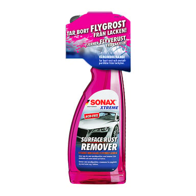 En rosa sprayflaske merket Sonax Rust Remover Xtreme Surface Rust Remover, med bilde av bilen sammen med produktinformasjon og instruksjoner. Emballasjen fremhever at den er syrefri og effektivt fjerner overflaterust.