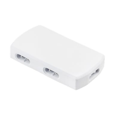 Anslut Switchbox är en slank, vit rektangulär enhet med en slät utsida och tre kontaktportar på sidorna, där varje har metallstift.