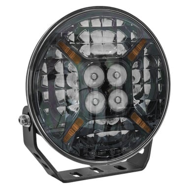 Reflektor LED Hamron Extra Light o okrągłym designie, odbijające wnętrze z wieloma płaszczyznami, cztery żarówki LED ustawione pośrodku, pomarańczowe detale oraz metalowy uchwyt zamontowany po lewej stronie.